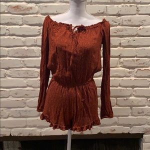 Orange over the shoulder jumpsuit